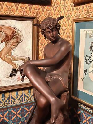 [bronze sculpture: nude male faunlike creature]